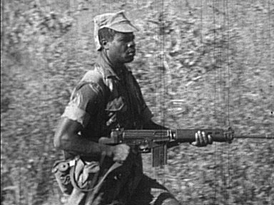Selous Scout on the move with FN FAL in hand.